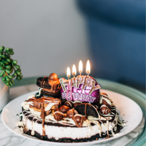 Chocolate Cake with White Icing on White Ceramic Plate