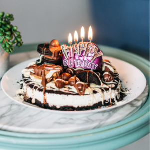 Chocolate Cake with White Icing on White Ceramic Plate